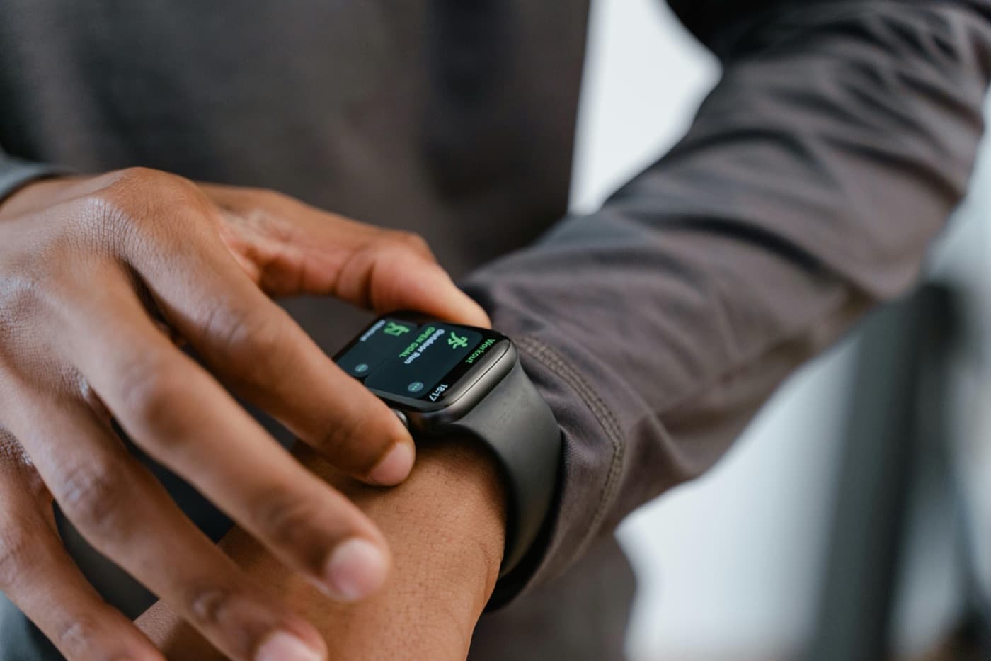 A person checking a workout on their smart watch